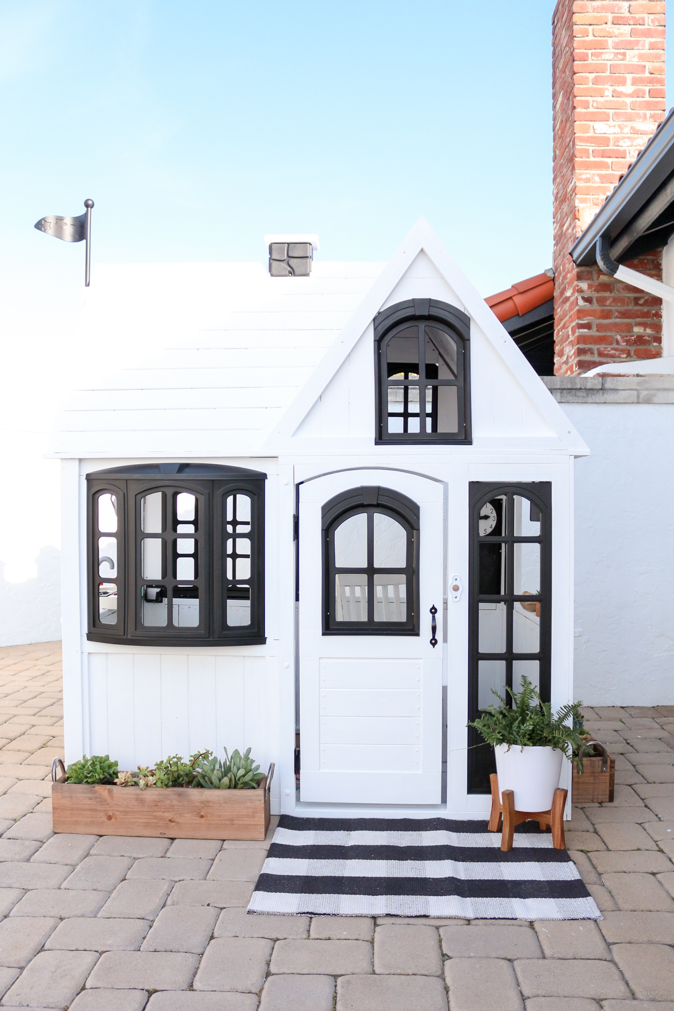 white wooden playhouse